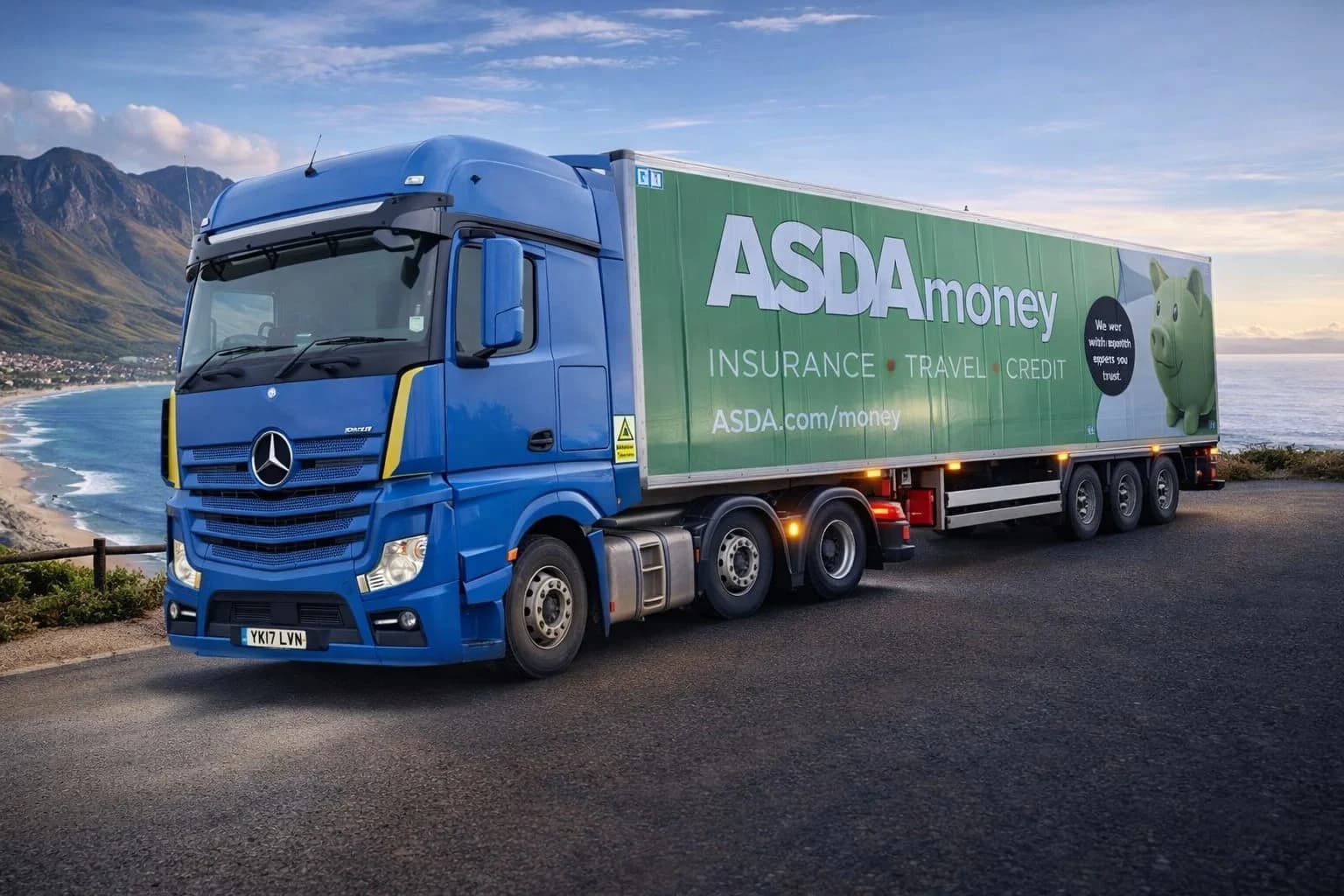Blue tractor unit carrying an ASDA branded trailer
