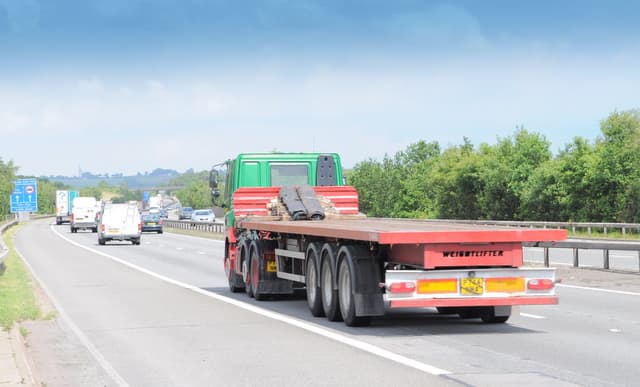 Flatbed lorry travelling on the M42 motorway