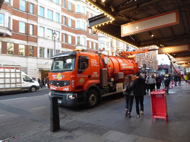 Heavy commercial vehicle operating on a busy central London street